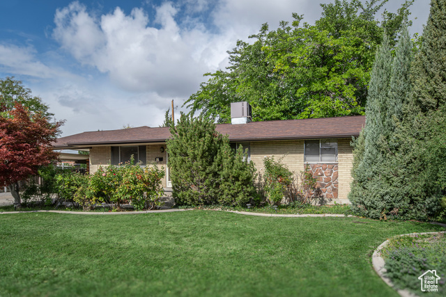 Welcome to this charming 5-bedroom, 2-bathroom rambler in a highly desirable Orem neighborhood, offering 2,879 square feet of versatile living space.  With mature trees, full landscaping, and a secluded, fenced backyard perfect for privacy and relaxation. Inside, you'll find a welcoming living area with a cozy wood stove, beautiful hardwood floors, and a finished basement, adding extra room for family gatherings or a home office. The kitchen is well-equipped with built-in appliances and a free-standing range, making meal preparation a breeze. Enjoy the convenience of main-floor laundry, electric dryer hookups, and additional basement laundry hook-ups, cold storage and additional bedrooms. This property boasts easy accessibility with a no-step entry, central electric air conditioning, and fully functioning and updated gas radiant heating.  This charming residence offers a perfect blend of comfort, functionality, and community, making it an excellent choice for those seeking a well-rounded home in a prime location.