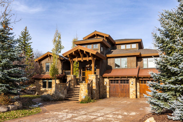 View of front facade featuring a garage