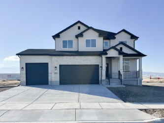 View of front of property featuring a garage