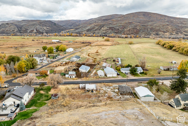 Drone / aerial view featuring a mountain view and a rural view