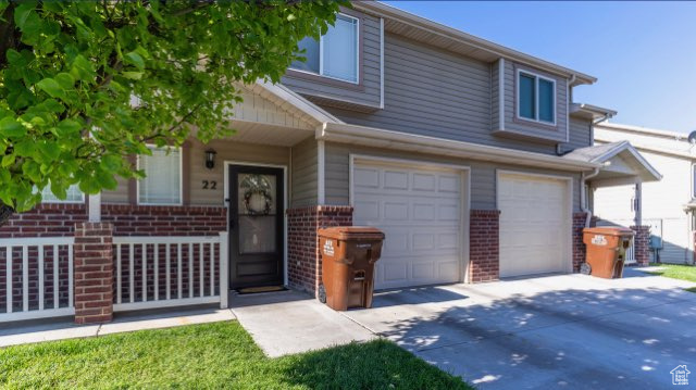 View of front of property with a garage