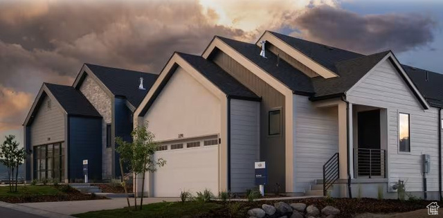 View of front of property with a garage