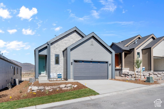 View of front of property with a garage