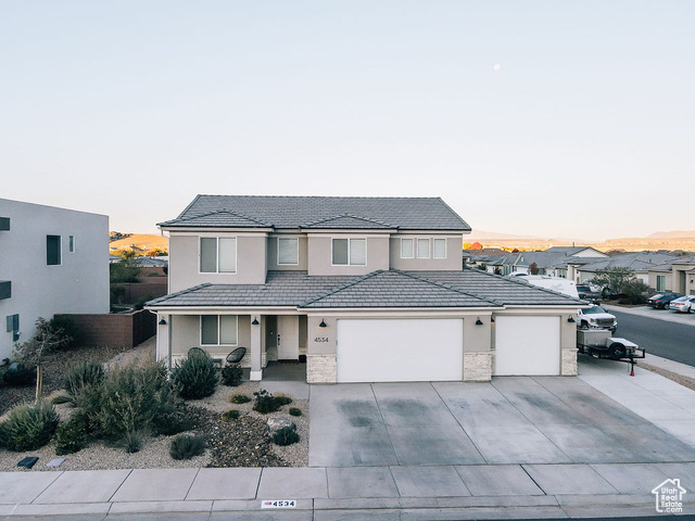 View of front of home featuring a garage