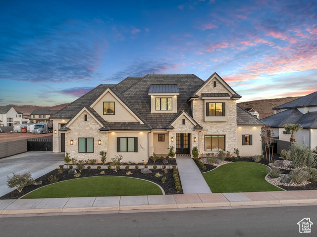 View of front of home featuring a lawn