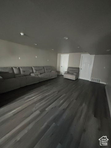 Unfurnished living room with hardwood / wood-style flooring