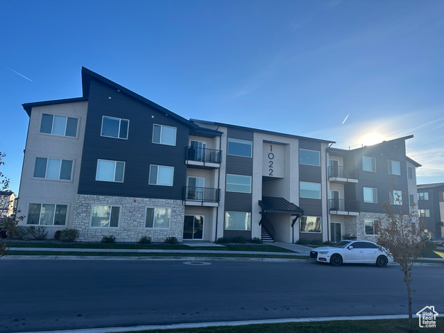 Welcome to this beautiful 3-bedroom, 2-bathroom condo, perfectly located in the heart of American Fork! Designed with modern living in mind, this home offers a bright and open floor plan with soaring 9-foot ceilings and stylish finishes throughout.  Light and bright living spaces with large windows, gorgeous kitchen featuring quartz countertops and upgraded finishes.  Durable and elegant laminate flooring throughout.  Spacious master suite with a private bathroom.  Relax on your covered patio, perfect for morning meditation or evening chats. Convenient garage for parking and storage.  Enjoy resort-style amenities including a swimming pool and pickleball courts, located directly across from the clubhouse for added convenience.  Minutes from Front runner station, freeway, shopping, restaurants and Pioneer Crossing and I-15.