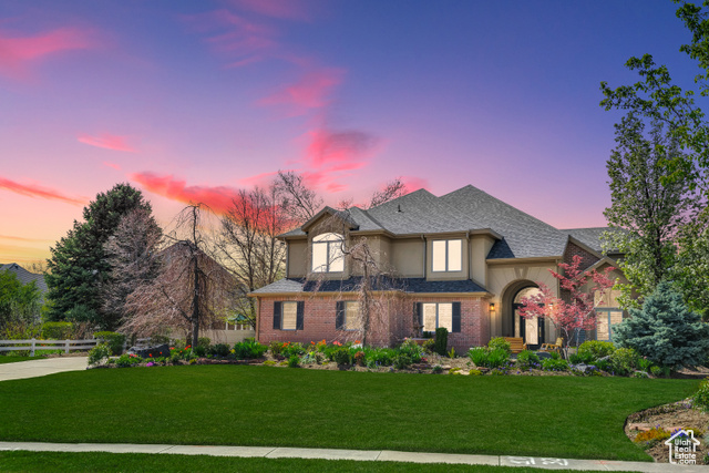 View of front of home featuring a lawn