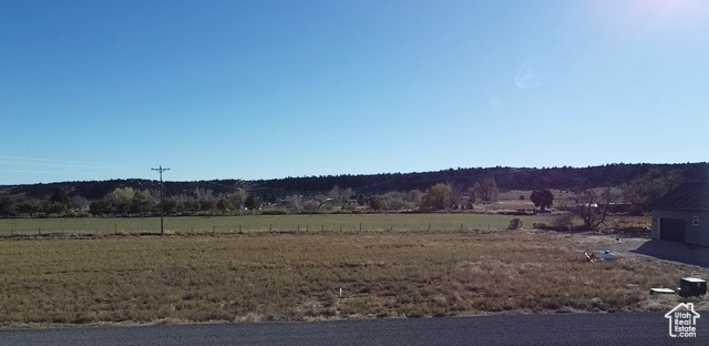 View of yard with a rural view