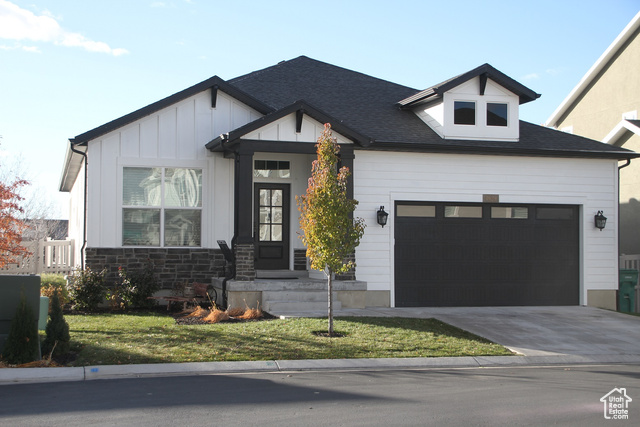 This lovely custom interior designed home nestled at the foot of the Rocky Mountains is one of a kind!   This property features 9' ceilings enhancing a large  comfortable family living space featuring durrable laminate flooring, granite counter tops, tile backsplash, undercounter lighting, gas range/double oven, pot filler, custom faucets and lighting fixtures through out,  custom tiled steam shower, master closet natural light suntube, double sinks, linen closet, two kitchens, large family/theater room with french door walkout basement.  The long list of extra ammenities include an electric fireplace, two tone paint, laundry room utility sink, two lighted shadow boxes, mother-in-law quarters with extra high ceilings, farmhouse sink, electric range, custom tiled bathroom with circular shower, work shop and strorage room.   Don't miss the chance to make this stunning home yours.  Wait, there is more!  Outside you will find gorgeous natural stone stairs and paved walkways leading to a relaxing fire pit and beautiful pergola covered hot tub. The wrap-around deck offers breath taking views of the towering nearby mountains. Optimally located next to schools, churches, temple, restarants, shopping, and only 5 min drive to the I-15 freeway. Don't settle for less.