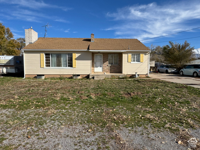 View of front of property with a front lawn