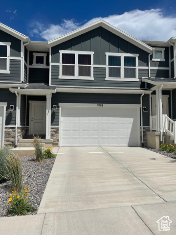 View of front of property with a garage