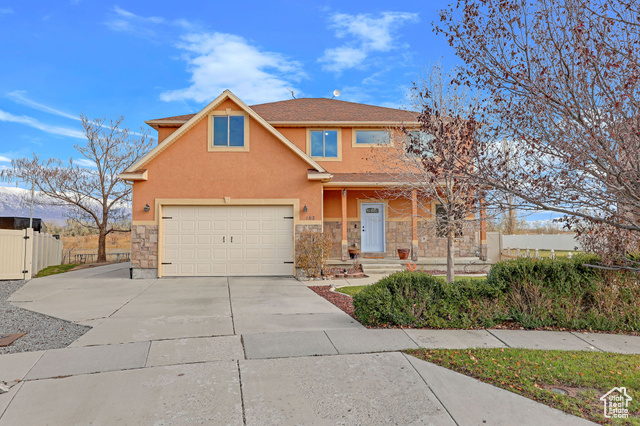 Front of property with a garage