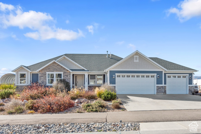 View of front facade featuring a garage