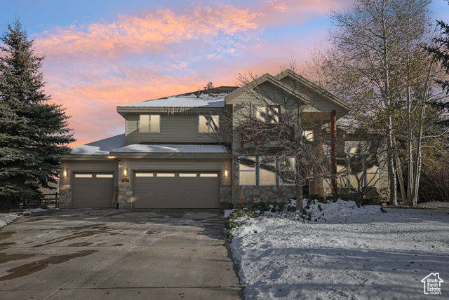 View of front facade featuring a garage