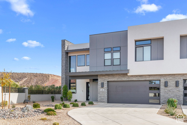 Contemporary house with a mountain view and a garage