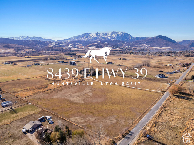 Aerial view with a mountain view and a rural view