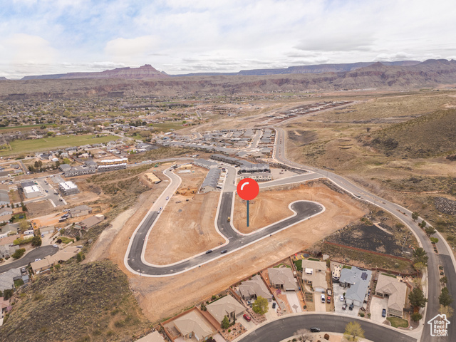 Birds eye view of property with a mountain view