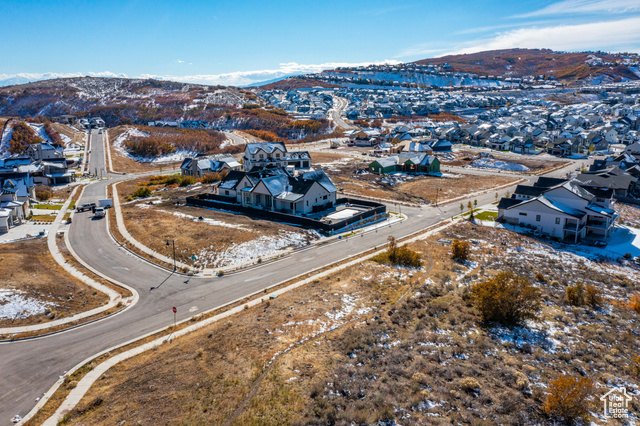 Birds eye view of property with a mountain view