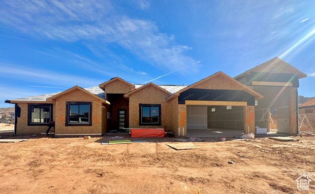 View of front of home featuring a garage