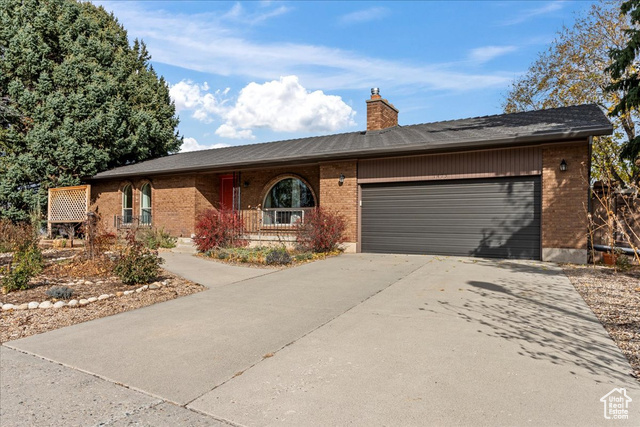 Ranch-style house featuring a garage