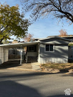 View of front facade featuring a carport