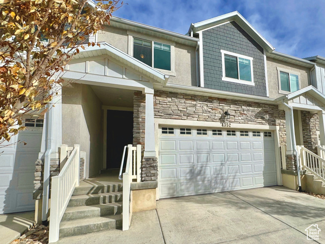 View of front of property with a garage