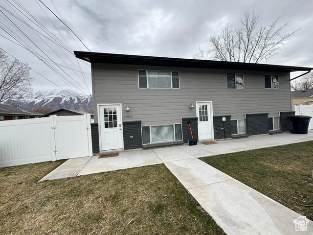 Front property with a yard and a patio area