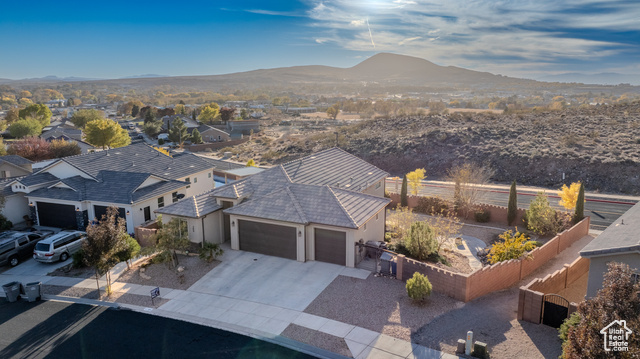 Birds eye view of property with a mountain view