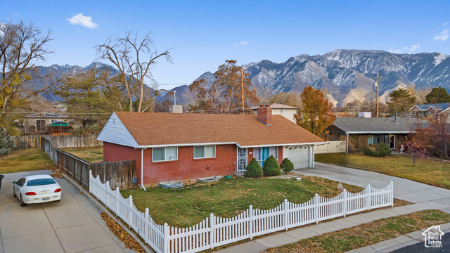 Welcome to this charming 5-bedroom, 3-bathroom rambler in the heart of Sandy, UT! Nestled in a peaceful neighborhood, this home boasts a spacious open-concept layout perfect for family gatherings. Enjoy cooking in the well-appointed kitchen with modern appliances, flowing seamlessly into inviting living spaces. The recently added new roof (just 6 months old) ensures peace of mind for years to come.   This property features both an attached and a detached garage, offering ample storage and parking options. Step outside to a lovely backyard, ideal for outdoor entertaining or quiet retreats. With its prime location and functional design, this home is a rare find-don't miss your chance to make it yours! Square footage figures are provided as a courtesy estimate only and were obtained from county records.  Buyer is advised to obtain an independent measurement.