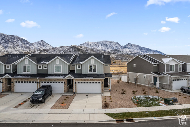 Discover this like new 2,206 square foot end-unit townhome nestled in this serene community of Santaquin. Enjoy mountain views from your private fenced patio. Offering the perfect blend of comfort and luxury. With 3 bedrooms, 2.5 bathrooms, and an unfinished basement with endless possibilities this home has it all. Take advantage of the community pool and pickleball court along with other amenities.  The 2-car garage provides secure parking, and the HOA covers water, sewer, and trash for a low-maintenance lifestyle. Don't miss this opportunity to own a piece of paradise. Schedule a showing today! Square footage figures are provided as a courtesy estimate only and were obtained from County Records. Buyer is advised to obtain an independent measurement.