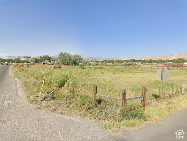 View of yard featuring a mountain view and a rural view