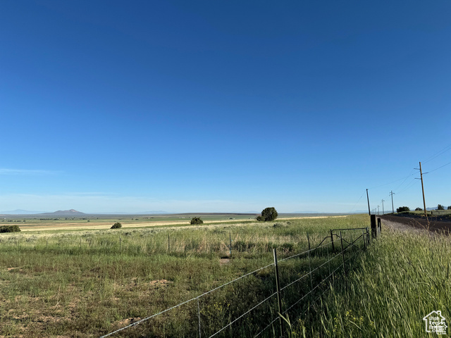 View of yard with a rural view