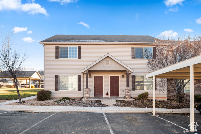 View of front of property with a carport