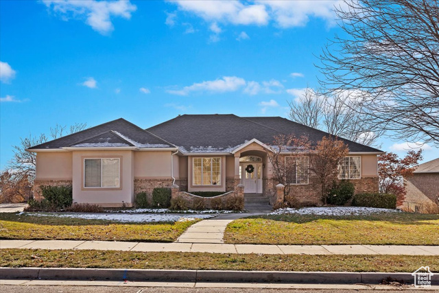 View of front of property with a front yard