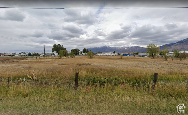 View of landscape featuring a mountain view and a rural view