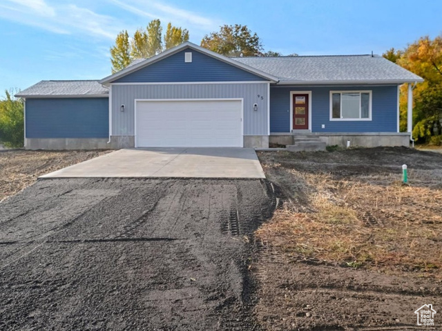 Ranch-style home featuring a garage