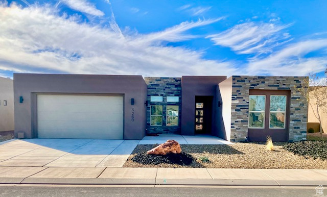 View of front of home featuring a garage