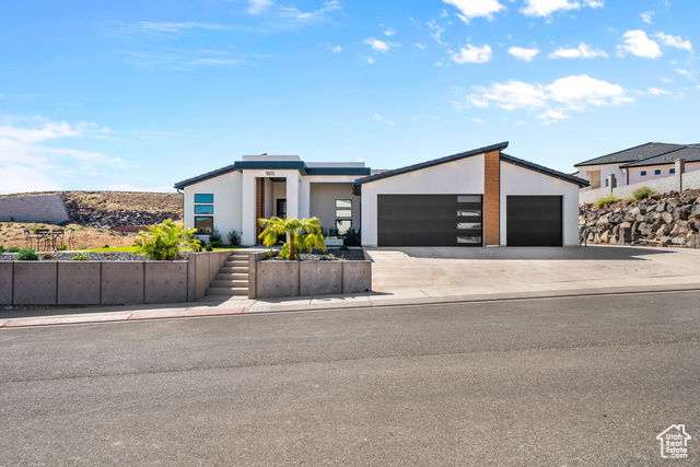 Contemporary home featuring a garage