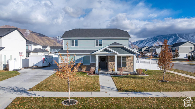 This meticulously maintained 4-bedroom, 2.5-bathroom home, built in 2020, offers both modern design and functionality in a sought-after neighborhood. Situated with easy access to the freeway and close proximity to the local rec center, this home is perfect for convenience and lifestyle.  The spacious layout features a gourmet kitchen with sleek quartz countertops, a large island, walk-in pantry, and a high-end stainless steel refrigerator/freezer typically found in million-dollar homes. The open-concept living area is perfect for both entertaining and everyday comfort. The primary suite is a true retreat, complete with a luxurious bathroom featuring double sinks, a separate tub and shower, and a generous walk-in closet.  This home is equipped with desirable features such as a fully fenced yard, RV parking, and ample storage throughout. You'll appreciate the thoughtful upgrades, including energy-efficient finishes, modern fixtures, and a smart home system.