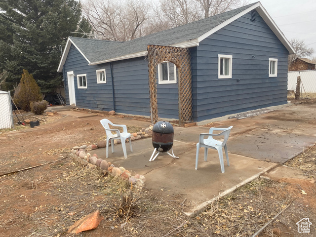 Back of house with a patio