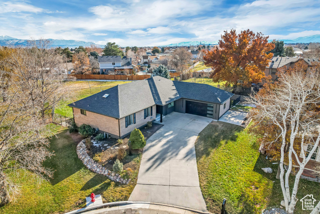 Christmas just came early for the Buyer who picks up this amazing South Jordan property. This 5 bedroom, 3 3/4 bath, fully renovated home is an absolutely masterpiece.  Located on the northern boundary of Daybreak in the Glenmoor golf community, this home has gone through a top-to-bottom luxurious reconstruction that checks every box on your Christmas wishlist. With no expense being spared, the home features a beautiful open floor plan with a fully renovated, top of the line chefs kitchen featuring custom handmade natural wood cabinetry, including the difficult to source Brazilian "Taj Mahal" quartzite for the kitchen counters, backsplash, and all upstairs bathrooms. This kitchen features a professional 36" gas range and hood, all new high-end appliances, and French door access to a stunning backyard covered deck that leads into an expansive private green belt. Added features of the home include brand new flooring throughout, beautiful luxury master ensuite with 4-head glass shower, beautiful garden tub with modern bronze fixtures, and LED mirror. Downstairs features a secondary living quarters with walk-out entrance, additional Master suite and bathroom, second full kitchen with walk-in pantry, and large separate bonus room perfect for an office or play area, and additional secondary laundry accommodations. Everything minus the brick has found an upgrade. This home is a "Must See" as it awaits its new owners. Give yourself and your family an early holiday treat and take the next step at making this your new home.  Call to schedule your own private showing today. Square footage figures are provided as a courtesy estimate only and were obtained from county records. Buyer is advised to obtain an independent measurement.