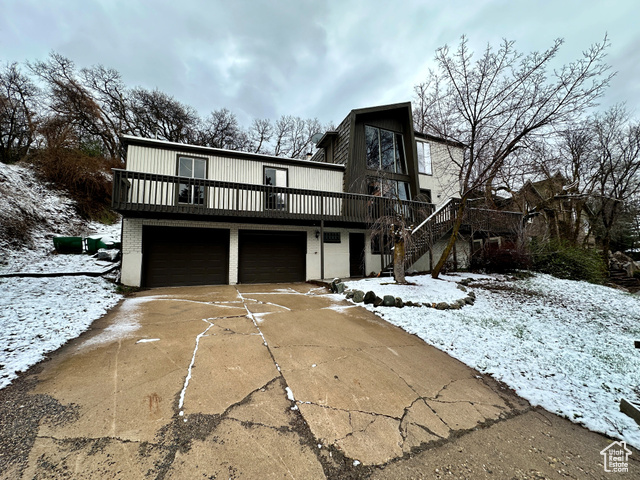 View of front facade featuring a garage