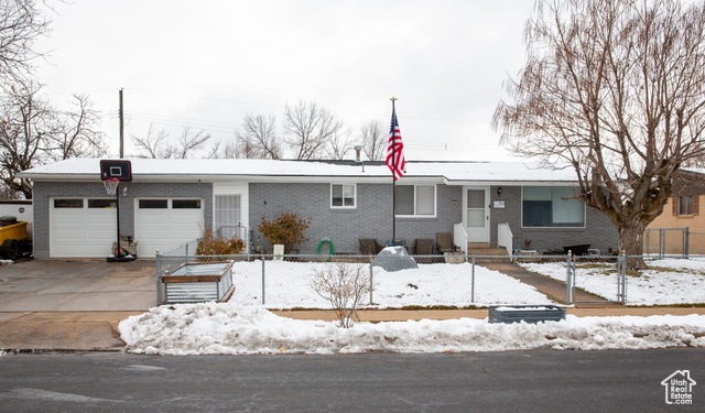 Ranch-style home with a garage