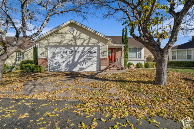 Ranch-style house featuring a garage