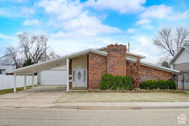 View of front of home with a carport