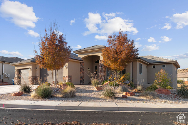 View of front of property featuring a garage