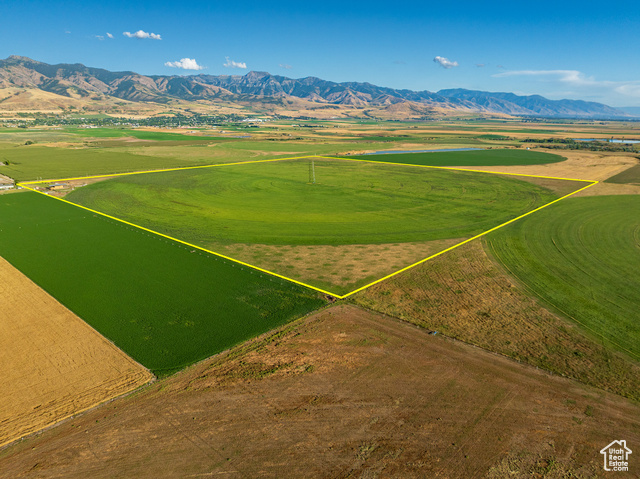 Birds eye view of property with a mountain view and a rural view