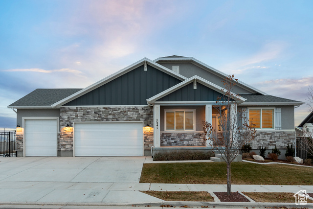 Craftsman-style home featuring a garage