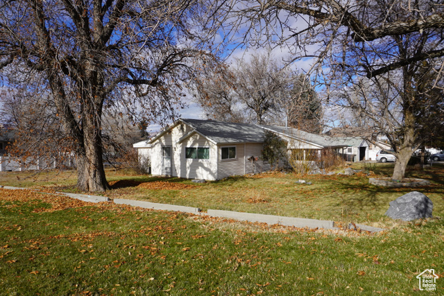 This charming 1,800 sq. ft. home, located right in the heart of Downtown Salem, offers 4 spacious bedrooms and 2 bathrooms, making it a perfect choice for families. Situated on a huge 1/2-acre lot, the property features a large yard with mature shade and fruit trees (plum, pear, nectarine and apple) and bushes (raspberries, blackberries and strawberries), and a garden spot (with grow beds and mature grape vines), creating a serene, green oasis. The backyard also includes a chicken/dog run, adding to the charm and functionality of this home. Inside, the home has been recently updated with new paint and carpet throughout, along with top-of-the-line windows valued at over $40,000, offering improved energy efficiency and modern appeal. The kitchen boasts new appliances, including a dishwasher and oven, along with other thoughtful upgrades throughout the home.  Located on a quiet street, this home is within walking distance to schools, Salem Pond, and the public library, offering convenience and a vibrant community atmosphere. In addition to the main home, the property includes a delightful detached Accessory Dwelling Unit (ADU) with approximately 900 sq. ft. of living space. This 2-bedroom, 1-bathroom unit, complete with an attached garage, has been recently updated with new carpet, paint, and outlets. The HVAC system was replaced just 6 months ago, ensuring comfort year-round. This ADU has a history of consistent rental income and can be used as a rental property, business office, or guest space, offering both privacy and flexibility. With its strong rental potential, this property is a fantastic opportunity for anyone seeking an investment or a versatile living arrangement.